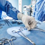 Close-up of sterilized and ready for use surgical instruments on medical tray during surgery operation in operating room at hospital